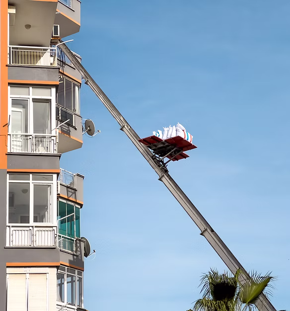 Home removal with hydraulic lift_ Transporters carrying goods by elevator from the window