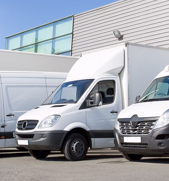 delivery white vans in service van fleet of cargo trucks courier and cars in front of the